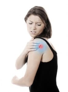 A picture of a young woman suffering from shoulder ache against white background